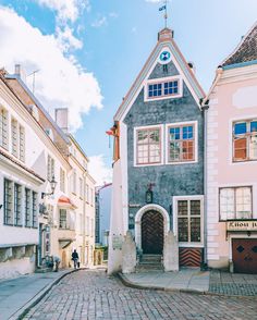 a cobblestone street lined with old buildings