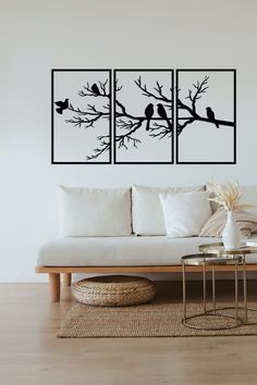 three birds sitting on a tree branch wall art