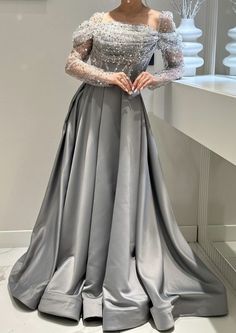 Women's elegant silver satin prom long dress, a-line sparkly long sleeves, off the shoulder floor length gown. Silver Prom Dress Sparkly, Silver Satin Prom Dress, Marriage Manifestation, Heavy Suits, Prom Dress Sparkly, Off The Should Dress, Printed Dresses Fashion, Silver Prom Dress, Dupatta Style