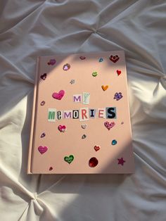 Light pink scrapbook with newspaper lettering spelling My Memories. Decorated with aesthetic heart stickers and jewels. Memories Scrapbook, Scrapbook Cover, Album Journal, Memory Journal, My Memories, Cover Journal, Seni Dan Kraf, Summer Scrapbook, Scrapbook Book