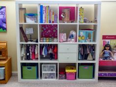 a child's room with toys and bookshelves