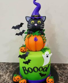 a halloween cake with a black cat on top