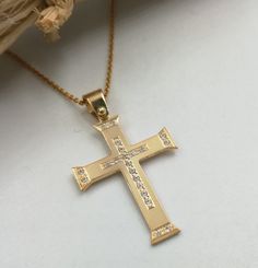 "A fine quality cross in 14K with yellow and white solid gold. It's decorated with 21 pieces of Swarovski stones!(it can also be set with REAL DIAMONDS ) A beautiful cross. Ideal for a present, engagement gift and baptism. ✪ Please check the dimensions to be sure about the size! Cross Pendant Dimensions: Height - 1.18 inches / 3 cm Width - 0,78 inches / 2 cm Thickness - 0,032 inches / 0,80 mm The chain is NOT included in the price. To see the inches and prices of the chains, please click on the 14k Gold Cross Necklace For First Communion, Yellow Gold Cross Pendant Necklace For Baptism, Yellow Gold Crucifix Necklace For Baptism, Yellow Gold Cross Necklace For Baptism, Yellow Gold Baptism Cross Pendant Necklace, White Gold Cross Pendant For First Communion, White Gold Cross Pendant Necklace For First Communion, Gold Diamond Cut Cross Necklace, Yellow Gold Cross Necklace For Anniversary