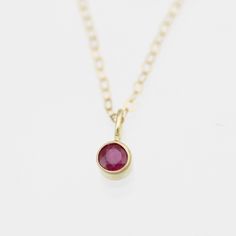 Very classy, simple, and dainty. This handcrafted gold pendant has a natural Ruby stone and comes on your choice of a 16 or an 18 inch gold chain with the artist's tag attached to the clasp. These look great when paired with other birthstone pendants or layered with other necklaces! Mix and match to create your own personalized necklace or mother necklace. Shown worn on the 16 inch chain. The pendant is also available without the chain, please make your selection when adding the item to your car Classic Yellow Gold Birthstone Necklace Gift, Mother Necklace, Mother Rings, Mothers Necklace, Ruby Stone, Birthstone Pendant, Natural Ruby, Drop Necklace, Drop Pendant