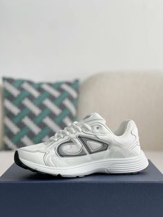 Embrace a sleek and sporty aesthetic with these Dior B30-inspired sneakers in a pristine white colorway. Crafted with breathable mesh and technical fabric, these shoes are perfect for those who value style and performance. The lightweight construction and sculpted rubber sole ensure all-day comfort and support, while the signature "CD30" logo adds a touch of Dior's iconic style. Whether you're hitting the gym or the streets, these sneakers will elevate your look with a touch of understated luxur White Low-top Technical Running Shoes, Technical White Low-top Running Shoes, Modern White Sneakers For Running Errands, White Technical Running Sneakers, White Breathable Technical Sneakers, White Technical Breathable Sneakers, Technical Breathable White Sneakers, White Technical Sneakers With Boost Midsole, Classic White Walking Shoes With Boost Midsole