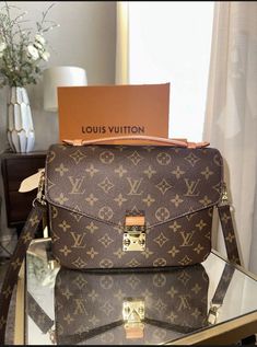 Gently used Louis Vuitton Pochette Métis purchased in March of 2021. -Purchased online at Louis Vuitton -Will come with original documents, box, string to tie box, and dust bag -Happy to provide any additional pictures and answer any questions! Additional Condition Details: -Light scratches on hardware -Minor stains on the inside Tie Box, Louis Vuitton Pochette Metis, Used Louis Vuitton, Pochette Metis, Shoulder Bag Brown, Louis Vuitton Pochette, Brown Canvas, Online Purchase, Bags Handbags