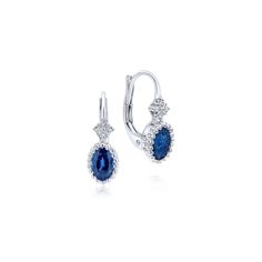 These graceful sapphire earrings are a truly timeless accessory. Set in polished 14k white gold, each oval cut September birthstone is surrounded by beaded detailing. Scintillating 0.04ct diamonds perfect these classic leverback drop earrings. B Quality Sapphires weigh 1.10tcw. Pink Diamond Ring, Luxury Earrings, September Birthstone, Diamond Drops, Diamond Drop Earrings, Sapphire Earrings, Timeless Jewelry, Timeless Accessories, Simple Earrings