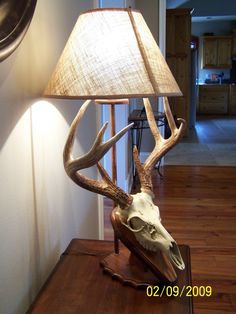 an antler lamp is on the table