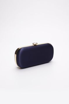 The Navy Bella Clutch is a custom designer clutch, and a timeless choice for an elegant wedding handbag. We’ve found your something blue… Your bridal purse. The Navy Bella Clutch is the perfect option for an evening wedding, as the duchess satin feels luxurious and sensible, without sacrificing style. Perhaps you’re celebrating on the New England coast at a chic hotel or private estate, complete your look with a stylish and elevated custom purse that you’ll love for years to come. The Bella Clut Elegant Evening Bag For Party, Elegant Evening Wedding Bag, Modern Blue Clutch For Formal Occasions, Chic Rectangular Clutch For Wedding Guest, Elegant Rectangular Clutch For Wedding Guest, Modern Gold Evening Bag For Formal Events, Chic Silk Evening Bag, Rectangular Satin Evening Bag For Party, Elegant Evening Clutch Bag