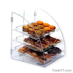 three tier acrylic display case with cupcakes and muffins