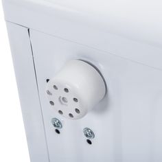 a white cabinet with two knobs on the front and one button on the back