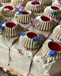 there are many desserts on the table ready to be cut into pieces and served