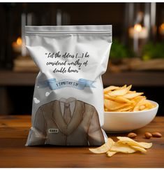 a bag of chips sitting on top of a table next to a bowl of chips