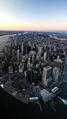 an aerial view of new york city at sunset