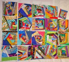 a quilted wall hanging with many different colors and designs on it's sides