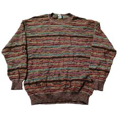 Vintage 90s Coogi Style Textured Knitted Crewneck Sweater - Classic Retro Knit Dive into the nostalgia of the 90s with this eye-catching vintage Coogi style crewneck sweater! Inspired by the iconic designs of Coogi Australia, this sweater features the same bold patterns and vibrant colors that defined an era. Perfect for fashion lovers who appreciate unique, statement pieces. Features: Era: 1990s Style: Coogi-inspired Material: High-quality 100% Cotton (Soft, warm, and durable) Design: Multicolo Retro Knit Sweater With Ribbed Cuffs, Retro Brown Knitted Tops, Retro Knitted Brown Tops, Retro Crew Neck Knit Top, Retro Textured Knit Crew Neck Top, Oversized Multicolor Vintage Sweater, Retro Multicolor Knit Sweater, Retro Brown Knit Sweater, Retro Long Sleeve Knitted Sweater