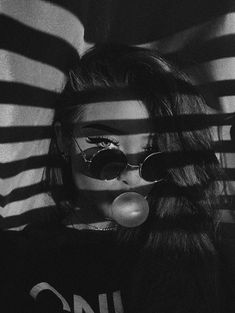 black and white photograph of a woman wearing sunglasses