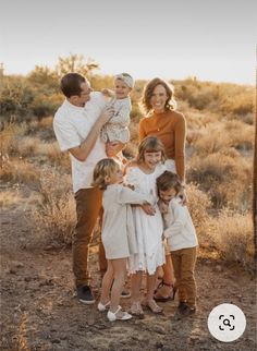 a family posing for a photo in the desert