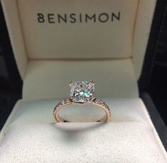 an engagement ring in a box with the name bensimon on it's side