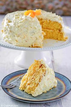 a piece of cake on a plate with a fork in it and another slice missing