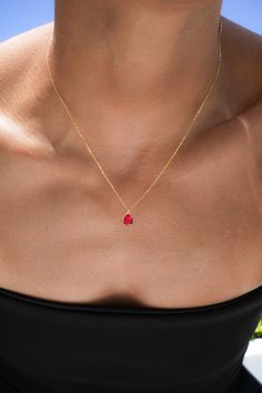 Elevate your style with our Tiny Ruby Pendant, a delicate necklace featuring a pear-cut ruby in a vibrant red shade. Perfect for July birthdays or gemstone enthusiasts, this teardrop-shaped ruby pendant blends sophistication with personal meaning. Ideal for layering or wearing solo, it offers timeless elegance for any jewelry collection.  Chain Length: 16+2" THEY ARE HIGH QUALITY CUBIC ZIRCONIA ♥️ Premium Materials: Expertly crafted from high-quality 925 sterling silver over 14k gold plated or rhodium , ensuring durability and a radiant shine. Small Ruby Necklace, Gold Ruby Jewelry, Hoco Jewelry, Ruby Jewelry Necklaces, Gold Ruby Necklace, Minimal Necklace, Ruby Pendant, Dainty Gold Necklace, Ruby Necklace