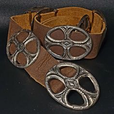 Excellent design on these vintage Native cast silver conchos. Good vintage patina. Conchos are all original and the leather is new Buffalo leather.  Tested silver.  Unmarked like many of the oldies. Buffalo leather measures 41" long, and it weighs 319 grams. The 7 conchos are 3" long.  C1970s Inventory #JBL 141 Silver Leather Concho Belt Buckles, Traditional Concho Belt Buckles For Western-themed Events, Bohemian Concho Belt Buckles For Western-themed Events, Vintage Silver Hand Tooled Belt Buckles, Hand Tooled Silver Leather Belt Buckles, Vintage Hand Tooled Leather Belt Buckles, Vintage Silver Leather Belt Buckles, Vintage Silver Concho Belt Buckles, Southwestern Hand Tooled Leather Belt Buckles