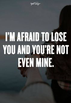 a woman holding her hand up to the sky with text saying i'm afraid to lose you and you're not even mine