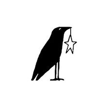 a black bird holding a star in its beak