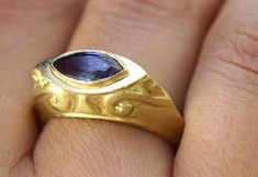 "A unique vintage-style Sapphire marquise signet ring in 14k and 18k yellow, 14k rose gold or 14k white gold. This unique signet-style ring has a magnificent blue Sapphire in a marquise cut, set in a decorated solid gold base. Handmade in Yellow, White, or Rose Gold, this Sapphire ring is eye-catching and stunning. This statement ring is made from high-quality materials that will stand the test of time, making this bold and original piece a part of your wardrobe for years to come. This gemstone Gold Marquise Ring, Marquise Sapphire, Boho Engagement Ring, Beautiful Gold Rings, White Gold Sapphire Ring, Unique Gold Rings, Signet Rings Women, Gold Sapphire Ring, Alternative Engagement Ring