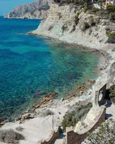 the water is crystal blue and there are steps leading up to it