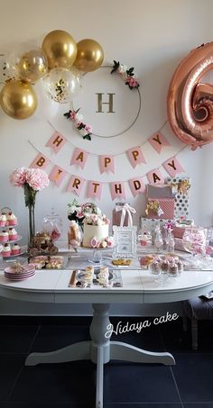 a birthday party with pink and gold decorations