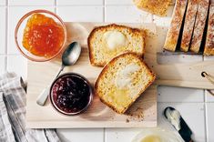 bread, jam and butter on a cutting board