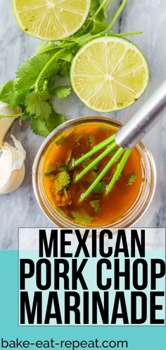 mexican pork chop marinade with limes and cilantro in a jar on a marble table