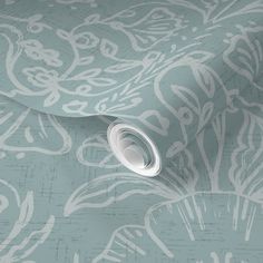 a blue and white wallpaper with an intricate design on it's surface,