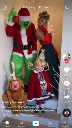 two children and an adult dressed up as santa clause, the grin - like man