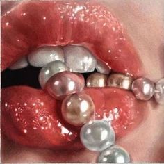 a woman's lips with pearls around them