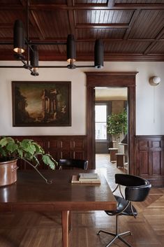 a large wooden table sitting in the middle of a room