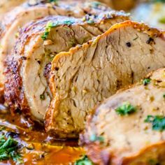 sliced pork roast with parsley on top