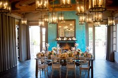 the dining room is decorated with candles and flowers