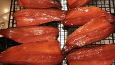 several pieces of bacon sitting on top of a cooling rack