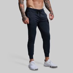 You thrive in moments of discomfort. The ones when you don’t know if you can keep pushing, but somehow, you keep going until the battle is won. To help you recover and come back stronger after every fight, we made our Rest Day Athleisure Jogger. Made from a soft fabric with added stretch, these joggers will have you welcoming every hard-earned rest day with unmatched comfort and style. Black Techwear Joggers For Sports, Supportive Black Gym Bottoms, Go-dry Techwear Activewear For The Gym, Supportive Black Sports Bottoms, Black Training Joggers, Black Joggers For Training, Black Joggers For Training And Sports Season, Sporty Black Athletic Fit Joggers, Functional Black Breathable Joggers