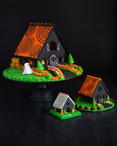 a cake that looks like a house with candy in the front and on the outside