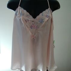 Very Elegant Satin Camisole And Tap Set Has Gray And Pink Flowers On The Neckline And Adjustable Straps. This 2x Is Comparable To A 20-22 Dress Size. 100% Polyester. Hand Wash Cold. Line Dry. No Bleach. Made In U.S.A. Pink Cami Sleepwear With Built-in Bra, Pink Sleeveless Camisole For Bedtime, Pink Sheer Camisole Sleepwear, Pink Feminine Camisole For Bedtime, Feminine Pink Camisole For Bedtime, Pink Spaghetti Strap Top For Pajama Party, Pink Camisole For Loungewear, Pink Camisole Sleepwear, Pink Lace Trim Camisole For Bedtime