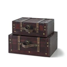 two wooden trunks stacked on top of each other