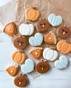 decorated cookies arranged in the shape of hearts and turkeys