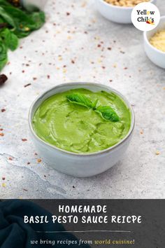 homemade basil pesto sauce recipe in a white bowl on a table with other ingredients