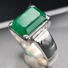 *I ship From Pakistan as my workshop is there. This is the reason we offer as much low prices compared to our regional jewellers* Natural Unheated Untreated beautiful Swat Rich green dark Emerald Rich Green Beautiful Color Highest Quality Emerald Premium 925 Sterling Silver Ring size 8 US Resize able as per buyer choice Stone weight 4.90 ct Premium Quality Engagement Ring Anniversary Ring Shipping option is FedEx Three working days Handling Time Contact me in case of any question about the item Elegant Untreated Green Emerald Ring, Classic Green Emerald Crystal Ring, Classic Emerald Green Crystal Ring, Untreated Green Emerald Ring Gift, Elegant Untreated Green Jewelry, Green Untreated Promise Ring, Untreated Green Promise Ring, Green Ruby Ring, Emerald Wedding Band