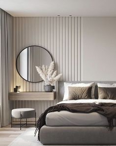 a bedroom with a large bed, mirror and chair in it's center area