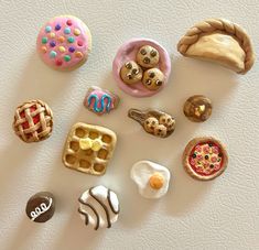 there are many miniature food items on the table