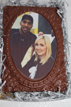 a chocolate photo frame with a man and woman in it